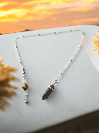 Tiger eye, selenite and clear quartz crystal pendulum with beaded chain.