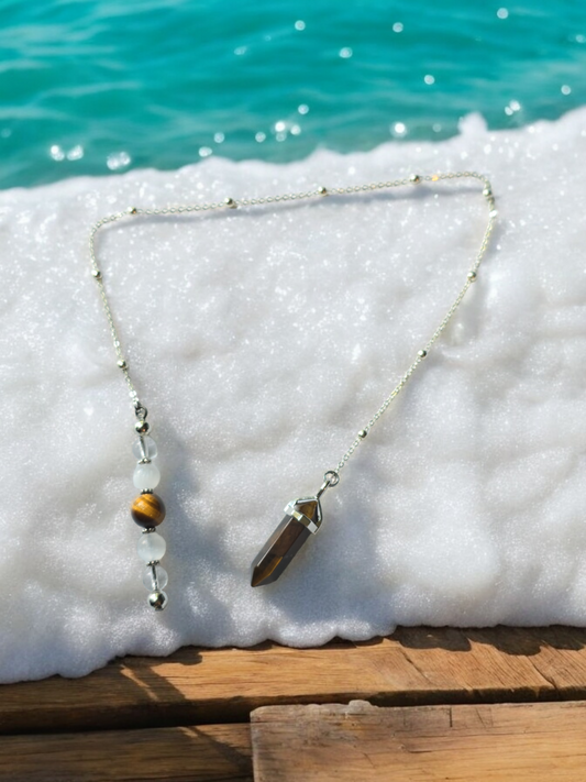 Tiger eye, selenite and clear quartz crystal pendulum with beaded chain.