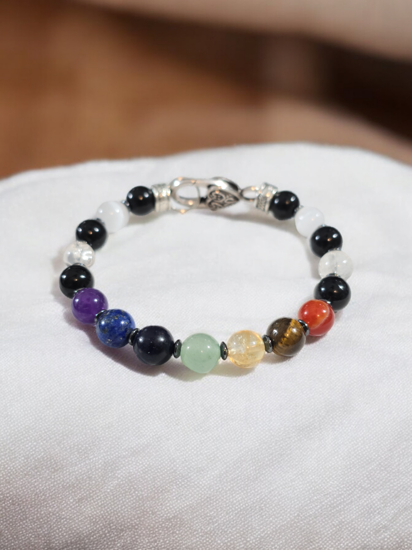 Natural Crystal  Chakra Bracelet. Carnelian. Tiger Eye. Citrine. Green aventurine. Sodalite. Lapis Lazuli. Amethyst. Clear crackle quartz and Selenite.  Silver Alloy Metal with Heart Clasp.