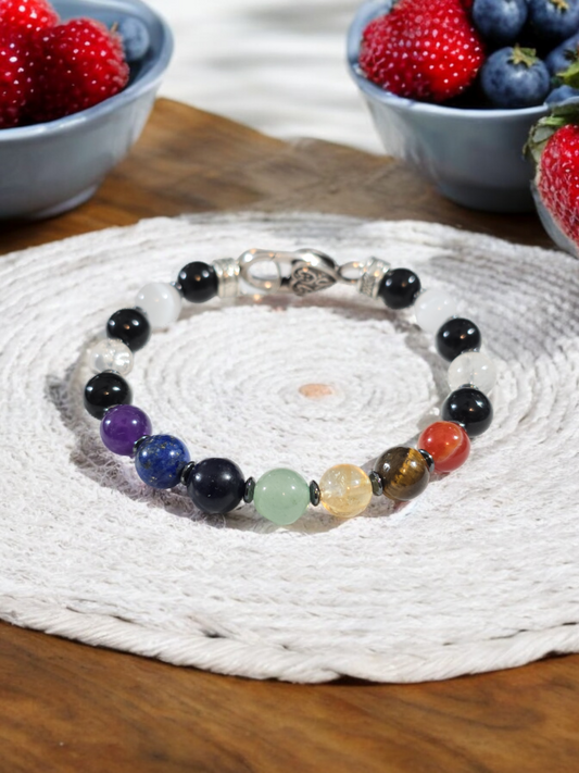 Natural Crystal  Chakra Bracelet. Carnelian. Tiger Eye. Citrine. Green aventurine. Sodalite. Lapis Lazuli. Amethyst. Clear crackle quartz and Selenite.  Silver Alloy Metal with Heart Clasp.