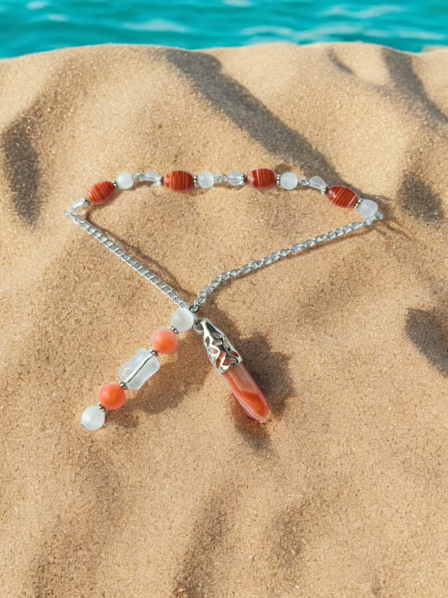 Carnelian with Clear Quartz and Selenite crystal pendulum with beaded chain.